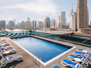 Отель Radisson Blu Hotel, Dubai Canal View
