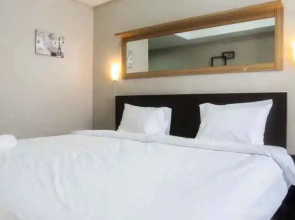 Minimalist Studio The Oasis Apartment near Omni Hospital Cikarang By Travelio