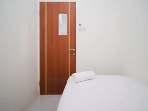 Cozy Living And Tidy 2Br At Puncak Dharmahusada Apartment