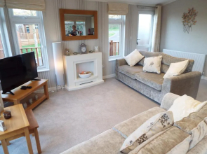 Devon Hills Holiday Park luxury timber lodge pet friendly with hot tub 2 to 6 guests