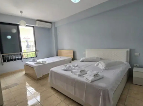 Tirent Apartment - Cozy Bedrooms Stay by Golem Beach.