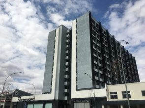 Highrise Windhoek apartment with skyline view, pool and gym