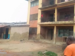 A 2-story building with 2 shops