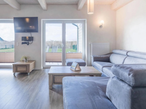 Exclusively furnished 5-star holiday home with a beach chair near the beach.