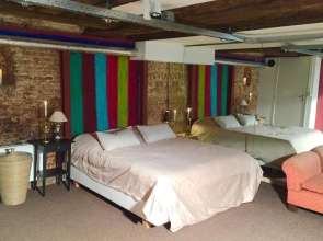 Top apartment along canal in historic centre