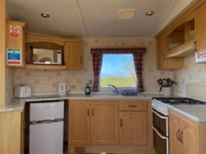 The Beach Hut, sleeps up to 4 guests and has a Private Hot Tub, FirePit, BBQ and is located in a Peaceful setting with Alpacas and gorgeous countryside views on Anglesey, North Wales
