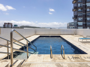 Stay Home Luxo | 1min Praia Gonzaga | Rooftop, Piscina, Sauna & Gym