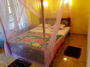 Malika's Yellow House