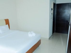 Simply Studio Room Atria Residence Apartment near Summarecon Mall By Travelio