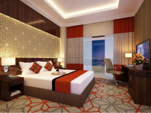 Отель Naumi Dubai