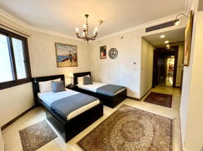 Luxury hotel apartment with pools in front AUC