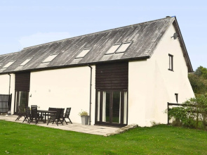 Beautifully converted 400-year-old threshing barn in East Devon. Pet-friendly.