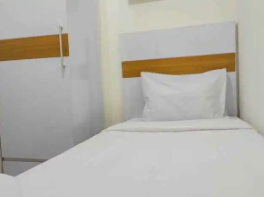 Comfy and Homey 2BR at Vida View Apartment By Travelio