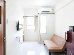 Homey and Modern 2BR at Puncak Kertajaya Apartment By Travelio