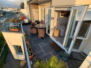 SEA BEACH & COASTAL VIEWS from LRG SUN TERRACE G Bay Apartments OVERLOOKS FISTRAL BEACH MOST DESIRABLE LOCATION SLEEPS & DINES 6 which includes SOFABED 2 BATHROOMS AL FRESCO Dining Smart tv all rooms PRIVATE PARKING 2 CARS sat-sat only April-Nov please