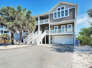 Walk to Beach: Oak Island Retreat w/ 210-yard Dock