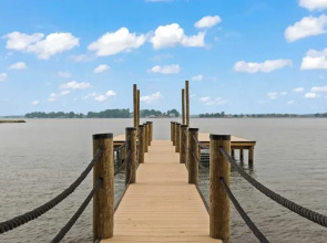 Waterfront Stay w/ Canoes, Deck, Game Room & Lake Views Near Mooresville Renwick Cove by Avantstay