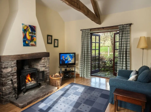 Cottage With Folding-doors in a Calm Environment Surrounded by Farming Fields