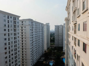 Monochrome Style 2 Bedrooms at Kalibata City Apartment By Travelio