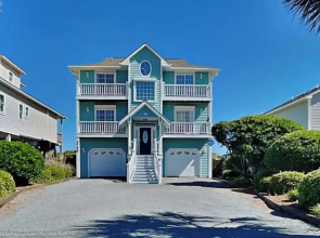 Blue Me A Wave by Topsail Realty