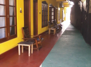 Malika's Yellow House