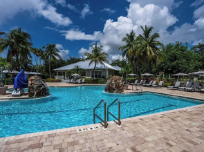 Asiago Vacation Rental at Lely Resort. Newly Furnished 2-Bedroom Condo with Stunning Lake & Golf Views. Spacious Retreat with Private Lanai, Resort Pool, Hot Tub and Gym Access