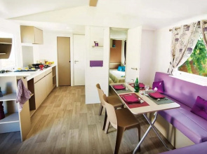 Cozy Mobile Home With Covered Terrace on a Luxury Campsite