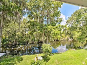 Old Florida Setting w/ Kayaks & Fishing Poles