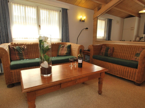 Well-furnished chalet with terrace near a recreational lake