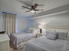 Gorgeous ground floor condo with private balcony steps from pool