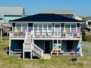 Sandy Bottoms 4 Bedroom Home by RedAwning