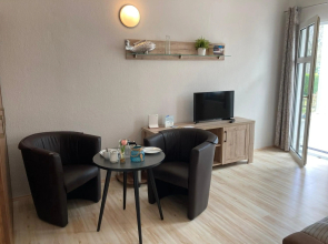 Ferienwohnung 4 Rosenbogen - Familienwohnung mit Wintergarten und Terrasse