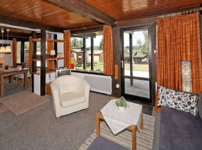 Wooden Chalet With Terrace Near a Swimming Lake