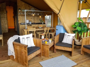 Campsite - Combined Tents With Kitchen and Bathroom Located Near a Pond