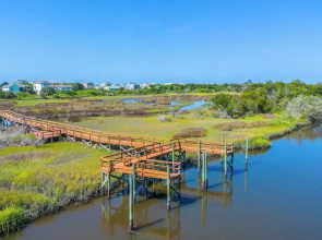 Walk to Beach: Oak Island Retreat w/ 210-yard Dock