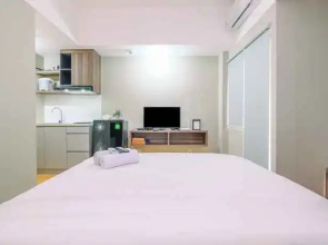 Comfortable Pool View Studio Room Apartment at LRT City Jatibening By Travelio