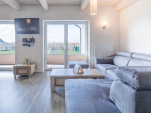 Exclusively furnished 5-star holiday home with a beach chair near the beach.