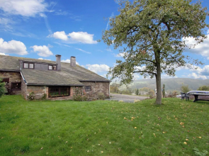 Farmhouse Situated at the Edge of the Woods