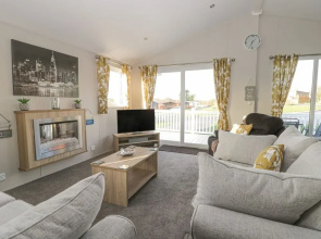 Stylish Lodge set in the Sand le Mere Holiday Park