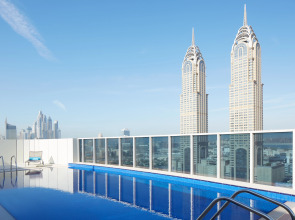 Отель Naumi Dubai