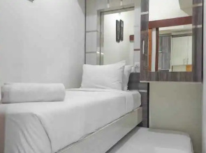 Cozy and Best Deal 2BR Vida View Apartment By Travelio