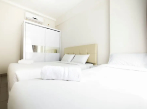 Elegant and Spacious 1BR Saveria Apartment near ICE BSD By Travelio