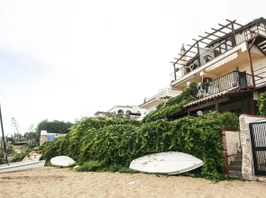 Casa la conchiglia sulla spiaggia