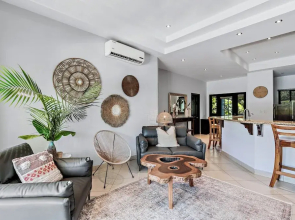 Stylish Home with Chic Decor, Luxury Amenities & Tropical Outdoor Oasis with Sparkling Private Pool