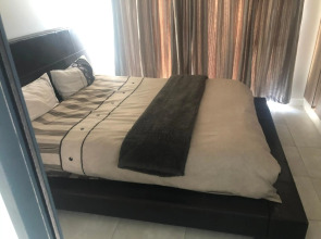 A Coastal/island experience at a Large 2 bed apartment at a Crystal Lagoon Estate.