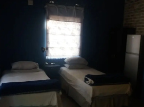 Room in Guest Room - Comfy Room With Dstv and Aircon in Convenient Location