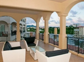 Tropical Waves at Porto Cupecoy by RedAwning