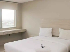 Cozy Studio Apartment at LRT City Jatibening By Travelio
