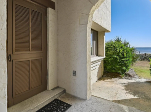 Nicely Furnished Downstairs Villa; That Opens To A Porch Overlooking The Ocean 2 Bedroom Villa by Peace Vacations
