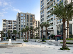 Апартаменты Сozy 1BR at Vida Residences Creek Beach